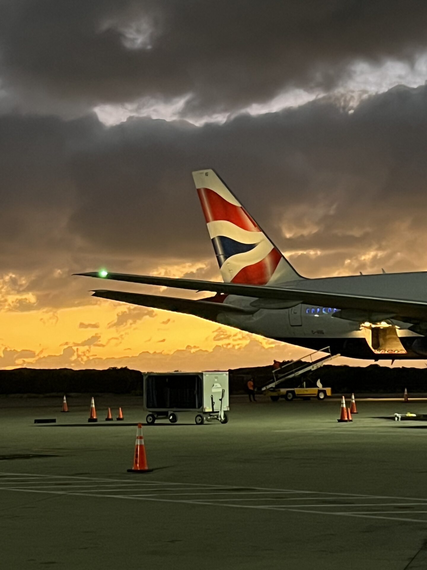 British Airways aircraft tail at sunset on the tarmac